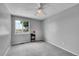 Bedroom with a large window, gray walls, and carpet flooring creating a cozy and relaxing atmosphere at 12366 Elm Way, Thornton, CO 80241