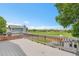 View from the gray deck overlooking neighborhood and vast green space at 12366 Elm Way, Thornton, CO 80241