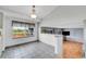 Bright dining area with tile flooring, natural light, and seamless flow to living spaces at 12366 Elm Way, Thornton, CO 80241