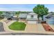 Two-story home featuring neutral siding, stone accents, a well-manicured lawn, and an attached two-car garage at 12366 Elm Way, Thornton, CO 80241