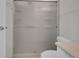 Bathroom featuring an enclosed shower with translucent glass doors and a white toilet at 3144 S Wheeling Way # 206, Aurora, CO 80014