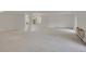 Spacious living room with open layout and neutral carpet at 3144 S Wheeling Way # 206, Aurora, CO 80014
