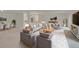 Bright living room with modern gray sofas, wood accents, and stylish decor offers comfortable seating and living space at 3144 S Wheeling Way # 206, Aurora, CO 80014