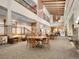 Comfortable lobby with seating, tables, lamps, grand staircase and lovely carpet at 3144 S Wheeling Way # 206, Aurora, CO 80014