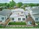 Aerial view of backyard featuring a wood pergola, artificial turf, wood fence, and rooftop patio at 6096 W Keene Ave, Denver, CO 80235