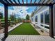 Enjoy the outdoors in this landscaped backyard featuring artificial turf and wood fence at 6096 W Keene Ave, Denver, CO 80235