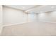 Unfinished basement area with carpet and window at 6096 W Keene Ave, Denver, CO 80235