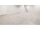 Large open finished basement with carpet flooring at 6096 W Keene Ave, Denver, CO 80235