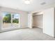 Bedroom features a large window with backyard views at 6096 W Keene Ave, Denver, CO 80235