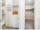 Organized walk-in closet featuring custom shelving and ample storage space at 6096 W Keene Ave, Denver, CO 80235