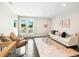 Comfortable Gathering room with stylish furniture, a textured rug, and access to the outdoors at 6096 W Keene Ave, Denver, CO 80235