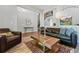 Comfortable living room with stylish decor, wood floors, and an open layout, perfect for relaxing and entertaining guests at 531 Americana Rd, Longmont, CO 80504