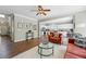 Open-concept living room connects to the kitchen, featuring hardwood floors and a seamless flow for easy entertaining at 531 Americana Rd, Longmont, CO 80504