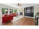 Comfortable living room with a fireplace, built-in shelving, and abundant natural light, creating a warm and inviting space at 531 Americana Rd, Longmont, CO 80504