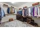 Spacious walk-in closet with ample hanging space, shelving, and a dresser, perfect for organizing your wardrobe at 531 Americana Rd, Longmont, CO 80504