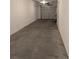Spacious garage featuring a smooth concrete floor and ample room for parking and storage at 9578 Pearl Cir # 105, Parker, CO 80134