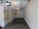 Bright and expansive garage with smooth concrete floors, offering plenty of storage and workspace at 9578 Pearl Cir # 105, Parker, CO 80134
