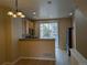 Open kitchen with stainless steel appliances and a breakfast bar near dining area at 9578 Pearl Cir # 105, Parker, CO 80134