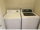 A tidy laundry space features a modern washer and dryer set at 9578 Pearl Cir # 105, Parker, CO 80134