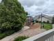 Playground featuring multiple slides and play areas in a community setting, with lush green trees and shrubs at 9578 Pearl Cir # 105, Parker, CO 80134