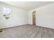 Bedroom featuring new carpet, a window, and ensuite bathroom at 39171 Anthony St, Elizabeth, CO 80107