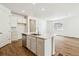 A kitchen island with stainless steel dishwasher and modern faucet. Lots of room for seating at 39171 Anthony St, Elizabeth, CO 80107