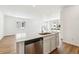 Bright kitchen features a center island with a stainless steel dishwasher and undermount sink at 39171 Anthony St, Elizabeth, CO 80107