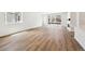 Sun-drenched open floor plan with wood-look floors, large windows and access to outdoor space at 39171 Anthony St, Elizabeth, CO 80107