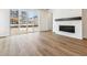 Living room with fireplace and sliding glass doors to backyard at 39171 Anthony St, Elizabeth, CO 80107