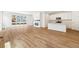 Bright living room open to a modern kitchen and featuring a sleek fireplace and recessed lighting at 39171 Anthony St, Elizabeth, CO 80107