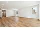 Bright living room with wood floors, recessed lighting, and large windows at 39171 Anthony St, Elizabeth, CO 80107