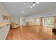 Spacious finished basement with a walkout, laminate flooring, and comfortable seating at 10224 W 68Th Way, Arvada, CO 80004