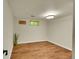 Finished basement with laminate flooring, neutral paint, and recessed lighting at 10224 W 68Th Way, Arvada, CO 80004