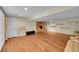 Finished basement with a fireplace, shelving, and comfortable seating at 10224 W 68Th Way, Arvada, CO 80004