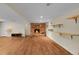 Finished basement featuring a stone fireplace and built-in shelving at 10224 W 68Th Way, Arvada, CO 80004