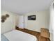 This bedroom features hardwood floors, a wall-mounted TV, and decor at 10224 W 68Th Way, Arvada, CO 80004
