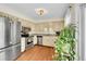 Well-lit kitchen with stainless steel appliances and ample cabinet space for an organized cooking area at 10224 W 68Th Way, Arvada, CO 80004