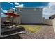 Outdoor patio with dining set, barbecue grill, surrounded by a rock-covered, low-maintenance yard at 4431 N Quatar Ct, Aurora, CO 80019