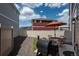 Outdoor patio with dining set and barbecue grill, surrounded by rock cover for low maintenance at 4431 N Quatar Ct, Aurora, CO 80019