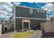 Outdoor patio with dining set, barbecue grill, and low-maintenance yard with rock cover at 4431 N Quatar Ct, Aurora, CO 80019