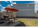Outdoor patio with dining set and barbecue grill, surrounded by low-maintenance rock cover at 4431 N Quatar Ct, Aurora, CO 80019