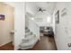 Entryway shows stairway access to the upper level and adjoins a living room and half bath at 4431 N Quatar Ct, Aurora, CO 80019