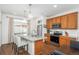 Bright, modern kitchen with granite countertops, stainless steel appliances, and a center island at 4431 N Quatar Ct, Aurora, CO 80019