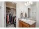 This bathroom features a door to a large walk-in closet with ample storage at 4431 N Quatar Ct, Aurora, CO 80019