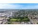 Aerial view highlighting residential homes in a suburban neighborhood on a sunny day at 598 S Navajo St, Denver, CO 80223