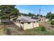 Exterior rear view of the home with a fenced yard on a sunny day at 598 S Navajo St, Denver, CO 80223