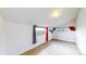 Modest bedroom with light walls, gray and red curtains, and plank flooring at 598 S Navajo St, Denver, CO 80223
