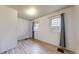 Cozy bedroom featuring two bright windows and clean, streamlined flooring at 598 S Navajo St, Denver, CO 80223