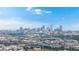 Breathtaking city view featuring the vibrant Denver skyline under a bright blue sky with scattered clouds at 598 S Navajo St, Denver, CO 80223