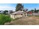 The rear exterior provides a glimpse of the home's structure and adjacent street at 598 S Navajo St, Denver, CO 80223